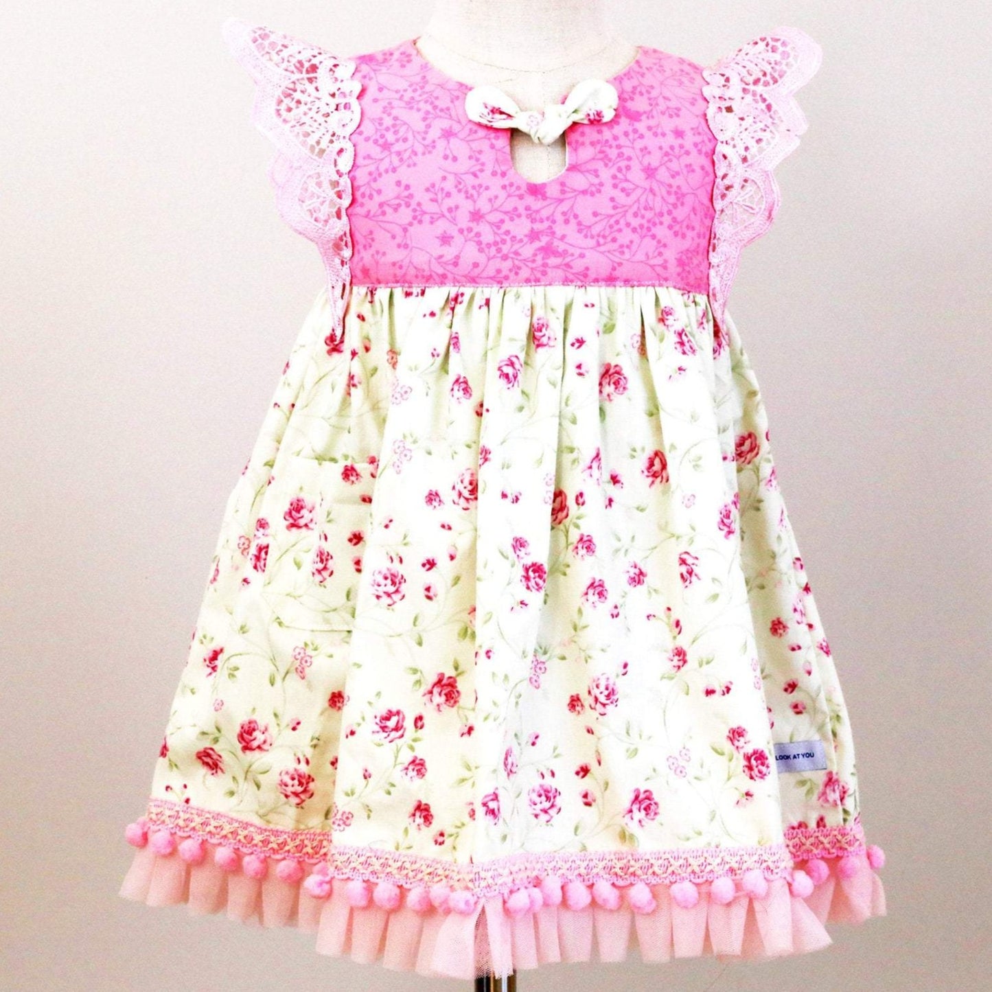 Dress - Maddie - Pink Bodice, Pink Roses on Pale Mint Green Skirt with Light Pink Lace Flutters and Lace/Pom Pom Hemline