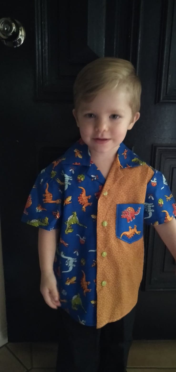 Shirt - Cartoon Dinosaurs on Blue Background with Mustard Contrasting Front Panel