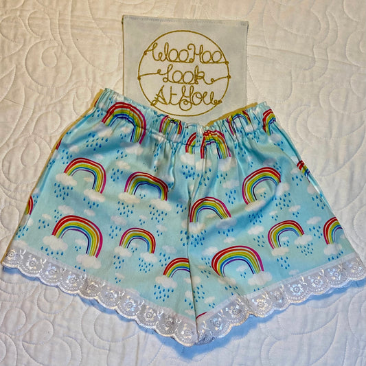 Shorts - Rainbows on Light Blue with White Anglaise Hemline and Elastic Waist